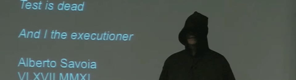 Alberto Savoia in a Grim Reaper costume next to the text "Test is dead, and I the executioner, Alberto Savoia VI.XVII.MMXI"